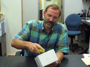 Phil opening a box