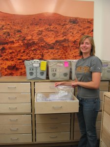 Laurie deposits the rock in its drawer